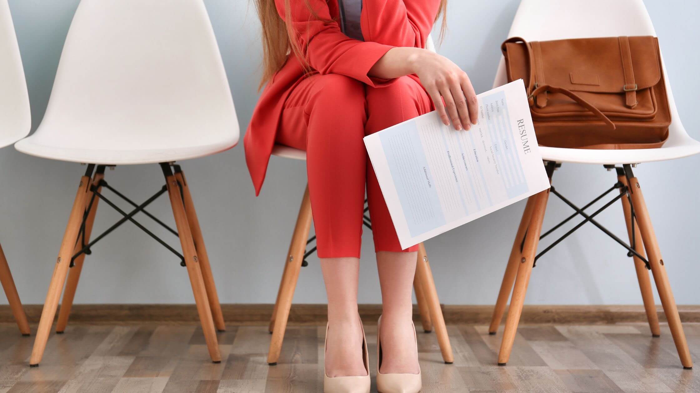 Woman waiting for a job interview hoping to land an interview.